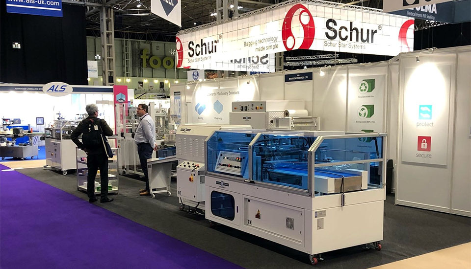 ME Shrinkwrap L Sealer and visitor on the stand at PPMA 2022